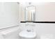 Bathroom with white tiled walls and a sink with a mirror at 205 Hillcrest Ave, Rock Hill, SC 29732