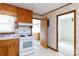 Kitchen features wood cabinetry and access to dining area at 205 Hillcrest Ave, Rock Hill, SC 29732
