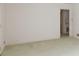 View of an empty room with light green carpet, white walls, and view to another room at 205 Hillcrest Ave, Rock Hill, SC 29732
