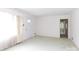 A bright living room with light green carpet, and white walls at 205 Hillcrest Ave, Rock Hill, SC 29732