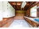 Interior view of a shed with wooden walls, storage cabinets, and a work bench at 205 Hillcrest Ave, Rock Hill, SC 29732