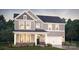 Charming two-story home with gray siding, stone accents, and a welcoming covered front porch at 264 Miramar Dr, York, SC 29745