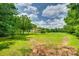 The backyard features a well-maintained lawn and mature trees at 284 Cedar Grove Rd, Clover, SC 29710