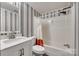A bathroom features a tub and shower combination with a white sink at 284 Cedar Grove Rd, Clover, SC 29710