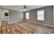 Large bedroom featuring plank flooring, a ceiling fan, and two windows at 284 Cedar Grove Rd, Clover, SC 29710