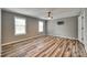 Spacious bedroom with dual windows, ceiling fan, and plank flooring at 284 Cedar Grove Rd, Clover, SC 29710