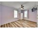This bedroom features light purple walls and wood-look floors at 284 Cedar Grove Rd, Clover, SC 29710