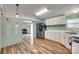 Bright kitchen offers stainless steel refrigerator, laminate countertops, and a seamless flow into the living area at 284 Cedar Grove Rd, Clover, SC 29710