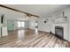 The living room shows a cozy fireplace, wood flooring, and a seamless transition to other areas of the home at 284 Cedar Grove Rd, Clover, SC 29710