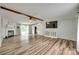 Spacious living room features wood flooring, a cozy fireplace, and an entertainment console beneath the TV at 284 Cedar Grove Rd, Clover, SC 29710