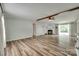 The expansive living room showcases wood floors, a fireplace, and sliding glass doors for great light at 284 Cedar Grove Rd, Clover, SC 29710