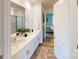 Bright bathroom features double sinks, sleek white cabinets, and a modern aesthetic throughout at 3090 Ora Smith Rd, Lincolnton, NC 28092