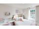 Bright bedroom features a cozy bed, a desk, and a large window at 3090 Ora Smith Rd, Lincolnton, NC 28092