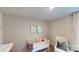 Cozy Bedroom features a white crib, a comfortable chair, and a calming color scheme at 3090 Ora Smith Rd, Lincolnton, NC 28092