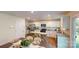 Open kitchen with white cabinets, stainless steel appliances, and a cozy dining area at 3090 Ora Smith Rd, Lincolnton, NC 28092