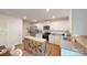 Well-lit kitchen with stainless steel appliances, granite countertops, and wood flooring at 3090 Ora Smith Rd, Lincolnton, NC 28092