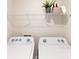 Functional laundry area with appliances, storage shelf, and neutral tones at 3090 Ora Smith Rd, Lincolnton, NC 28092
