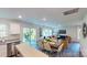 Open-concept living room features dining area, modern decor, and lots of natural light at 3090 Ora Smith Rd, Lincolnton, NC 28092