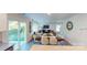 Open-concept living room features dining area, modern decor, and lots of natural light at 3090 Ora Smith Rd, Lincolnton, NC 28092