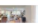 Open-concept living room with large windows, neutral decor, and a seamless flow to the dining area at 3090 Ora Smith Rd, Lincolnton, NC 28092