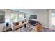 Bright and open living room featuring a large TV, comfortable seating, and stylish decor at 3090 Ora Smith Rd, Lincolnton, NC 28092