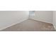 Small bedroom featuring carpeted flooring, bright natural light, and neutral wall paint at 3107 Riker St, Clover, SC 29710