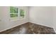 Cozy bedroom featuring ample natural light with hardwood floors and neutral wall paint at 3107 Riker St, Clover, SC 29710