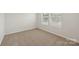 A well-lit bedroom featuring neutral carpet and a window at 3107 Riker St, Clover, SC 29710