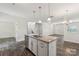 Open kitchen featuring granite counters, stainless steel appliances, and pendant lighting over a large island at 3107 Riker St, Clover, SC 29710