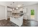 Stylish kitchen featuring white cabinetry, a granite-topped island, and stainless steel appliances at 3107 Riker St, Clover, SC 29710