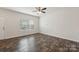 Bright, open living room with hardwood floors, a ceiling fan, and plenty of natural light at 3107 Riker St, Clover, SC 29710