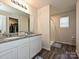 Beautiful bathroom with double vanity, granite countertop and a large glass door shower at 323 J C Dellinger Rd, Cherryville, NC 28021