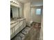 Stylish bathroom featuring double sinks, granite countertops, and a glass-enclosed shower at 323 J C Dellinger Rd, Cherryville, NC 28021