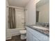 Functional bathroom featuring a granite vanity, tub-shower combination, and modern fixtures at 323 J C Dellinger Rd, Cherryville, NC 28021