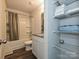 Bathroom featuring granite vanity, shower-tub combo, and a shelving unit with towels at 323 J C Dellinger Rd, Cherryville, NC 28021