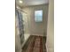 Modern bathroom with a shower, wood-look floors, and ample natural light at 323 J C Dellinger Rd, Cherryville, NC 28021