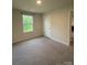 Inviting bedroom with a neutral color scheme, plush carpet, and natural light at 323 J C Dellinger Rd, Cherryville, NC 28021