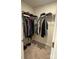 Carpeted walk-in closet with ample storage and clothing racks at 323 J C Dellinger Rd, Cherryville, NC 28021