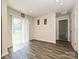Bright dining area with sliding glass doors leading to the backyard, featuring hardwood floors at 323 J C Dellinger Rd, Cherryville, NC 28021