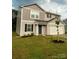 Charming two-story home with black shutters, landscaping, and attached garage at 323 J C Dellinger Rd, Cherryville, NC 28021