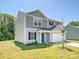 Two-story home with gray siding, black shutters, a blue front door and a two-car garage at 323 J C Dellinger Rd, Cherryville, NC 28021