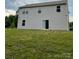 Gray two-story home with siding, and large grassy backyard at 323 J C Dellinger Rd, Cherryville, NC 28021