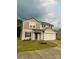 Charming two-story home with black shutters, landscaping, and attached garage at 323 J C Dellinger Rd, Cherryville, NC 28021