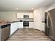 Well-equipped kitchen featuring stainless steel appliances, granite countertops, and ample cabinet space at 323 J C Dellinger Rd, Cherryville, NC 28021