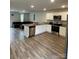 Open-concept kitchen with stainless steel appliances, granite countertops, and modern cabinetry at 323 J C Dellinger Rd, Cherryville, NC 28021