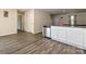Open floorplan between kitchen and living room, featuring stainless dishwasher, granite countertops and white cabinets at 323 J C Dellinger Rd, Cherryville, NC 28021