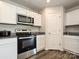 Close up of modern kitchen with stainless steel appliances, including a microwave and oven range at 323 J C Dellinger Rd, Cherryville, NC 28021