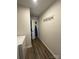 Functional laundry room with a washer, wood-look flooring, and storage space at 323 J C Dellinger Rd, Cherryville, NC 28021