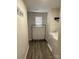 Bright laundry room with a washer, shelving, and a clothes rack for drying at 323 J C Dellinger Rd, Cherryville, NC 28021