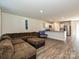 Open-concept living area with hardwood floors, a large sectional couch, and a combined kitchen space at 323 J C Dellinger Rd, Cherryville, NC 28021